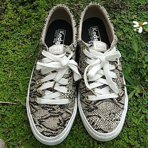 Keds snakeskin sneakers.